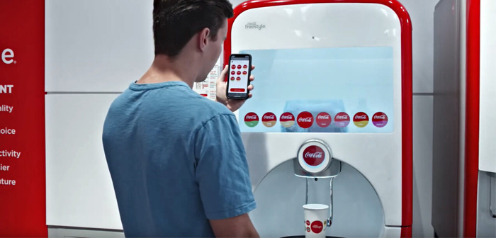 Gracias a la modificación presentada al público en julio, los consumidores que se aproximen a uno de estos puestos podrán introducir los comandos desde un terminal móvil, siendo innecesario que entren en contacto con la pantalla táctil del aparato.